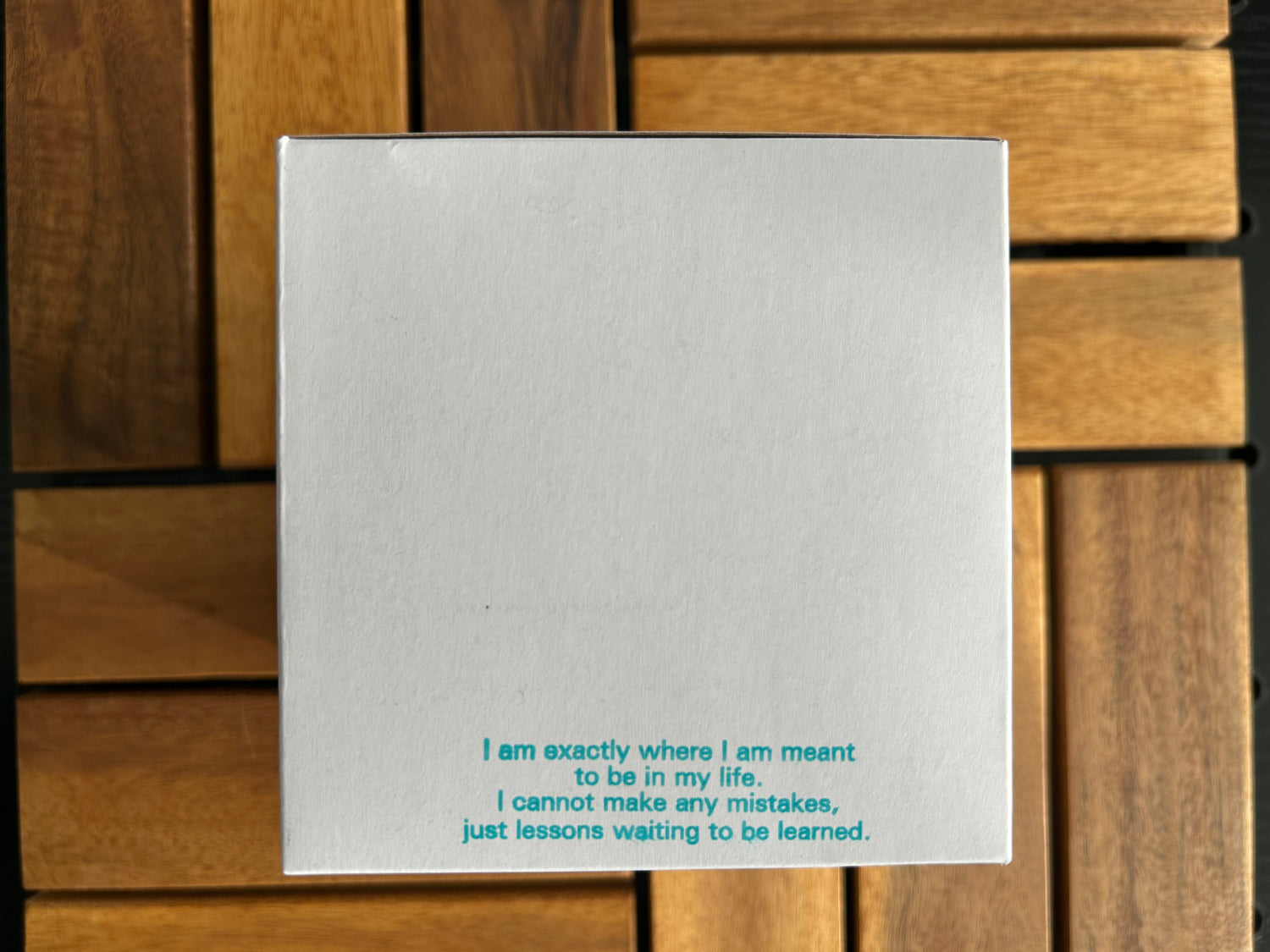 Poem stamped on the side of our garden kit boxes. Poem: I am exactly wcannhere I am meant to be in my life. I ot make any mistakes, just lessons waiting to be learned.